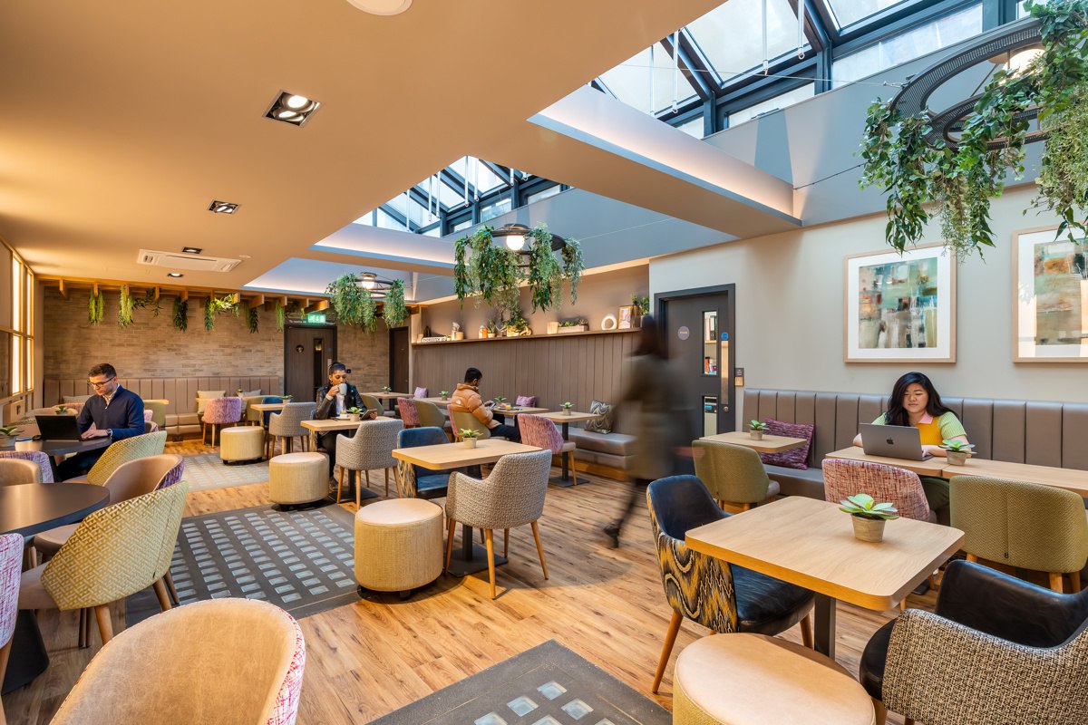 Communal seating and dining area for guests at Point A Hotel Shoreditch